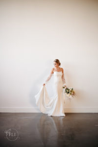 cincinnati photographer captures bride in sleek gown at sample space wedding venue